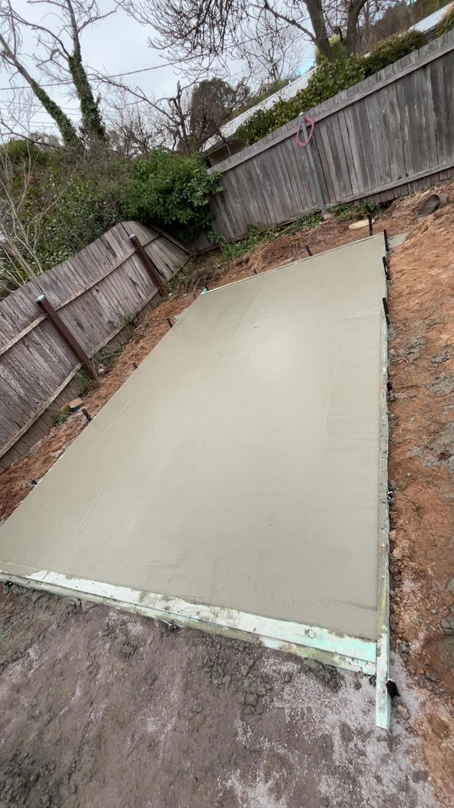 Charcoal shed, concrete slab