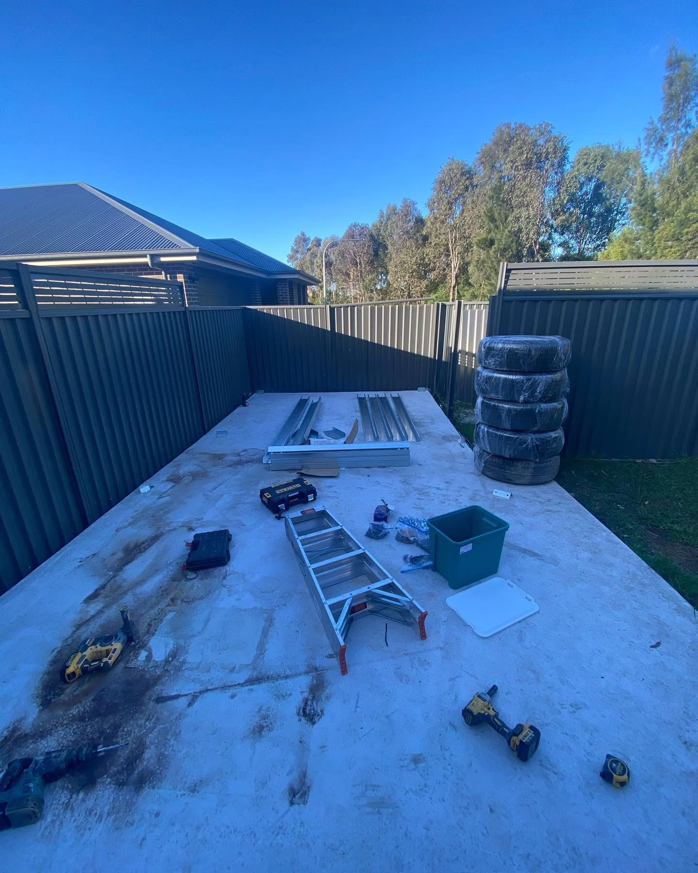 The concrete slab down, tools and materials staged.